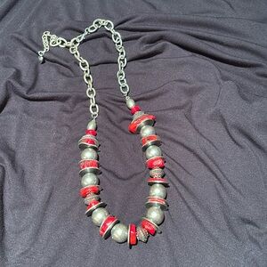 Costume jewelry with silver balls with red accents
